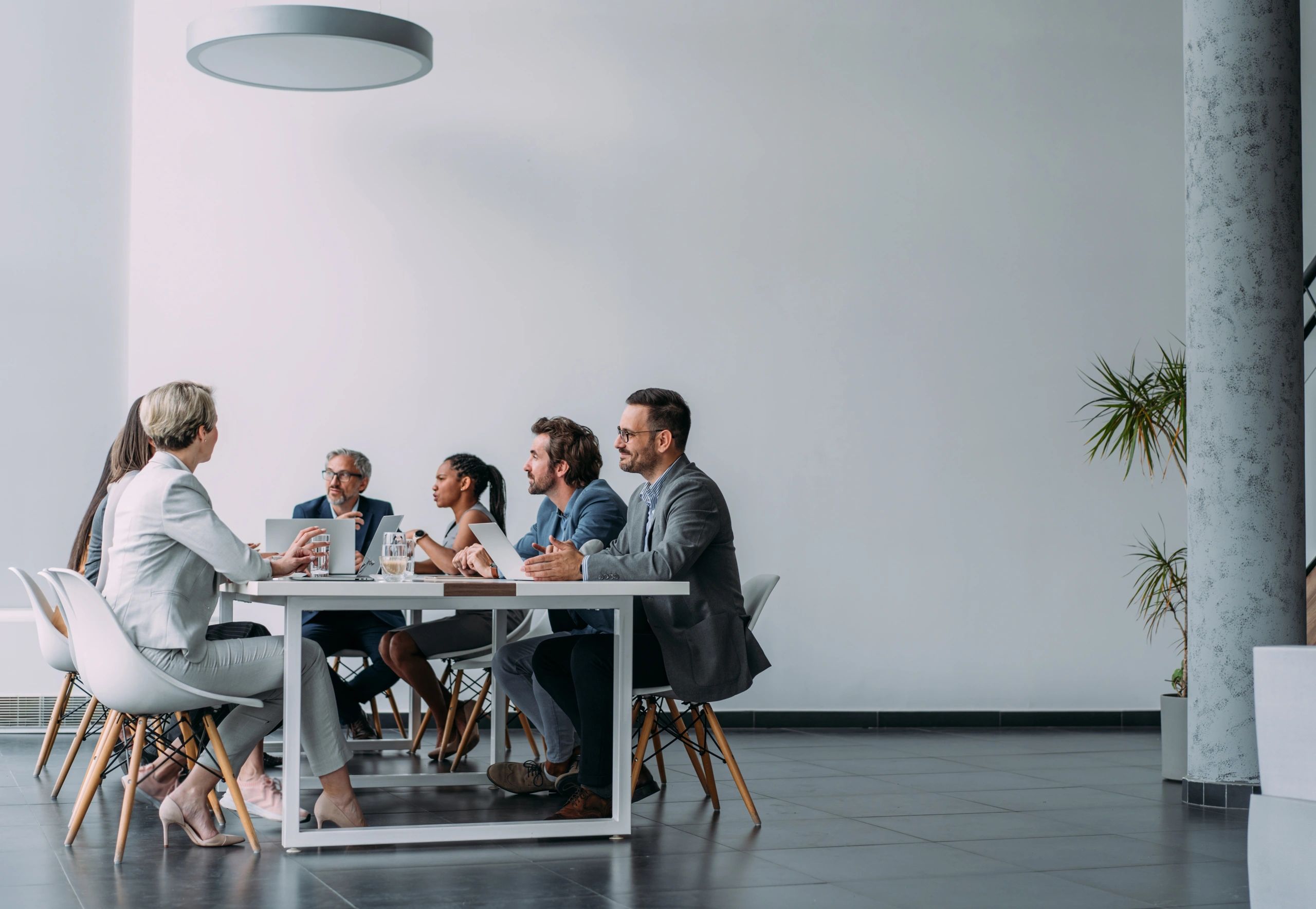 Recruitment team meeting with employers in a modern office