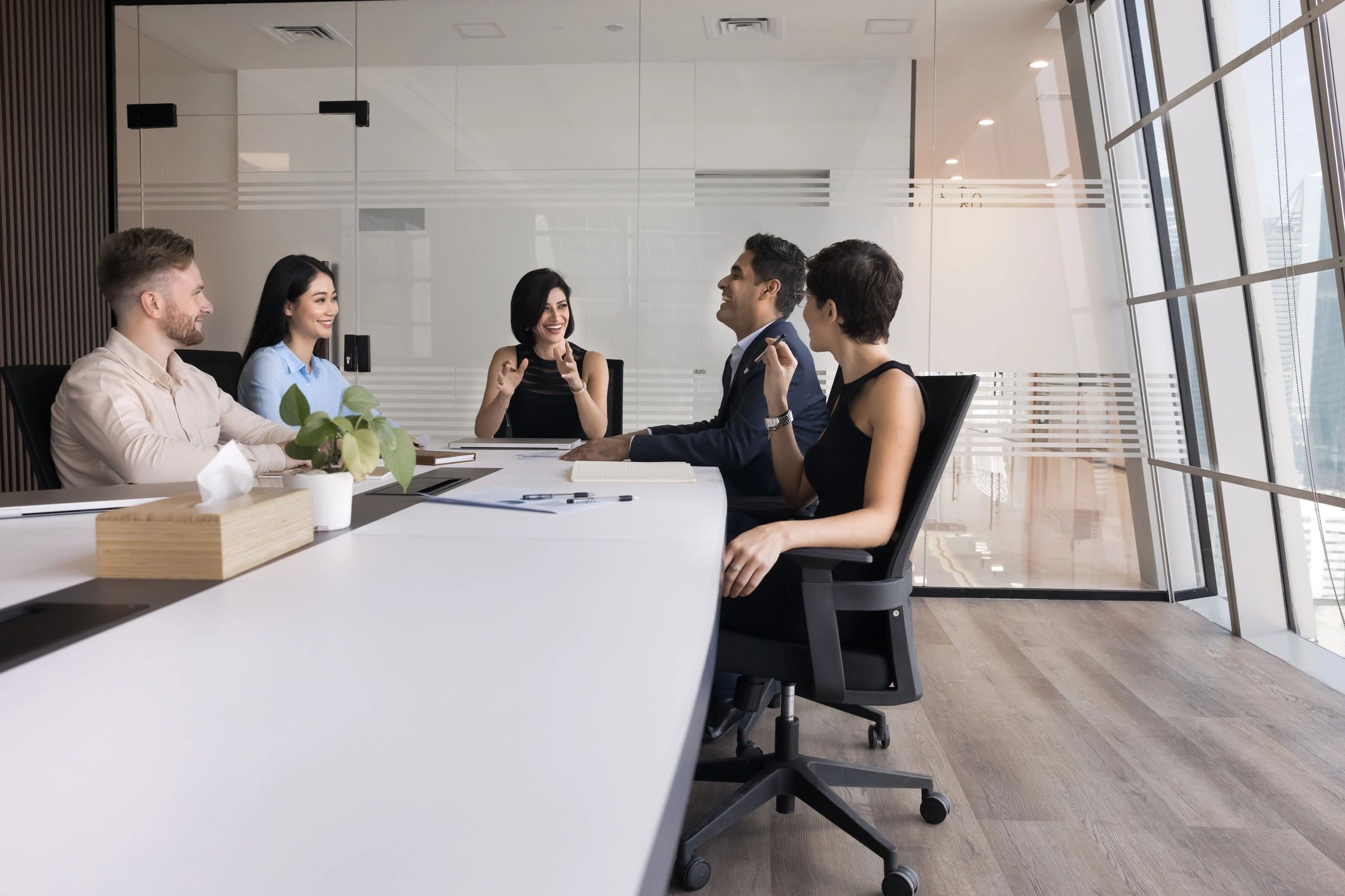 Recruitment team meeting with clients in a modern office